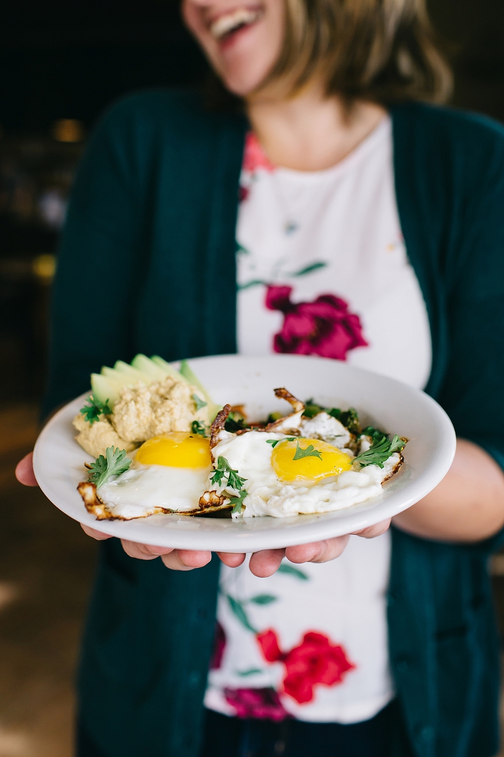 A woman carries a heaping plate of eggs at Whole Wheat & Honey restaurant in Fort St. John.