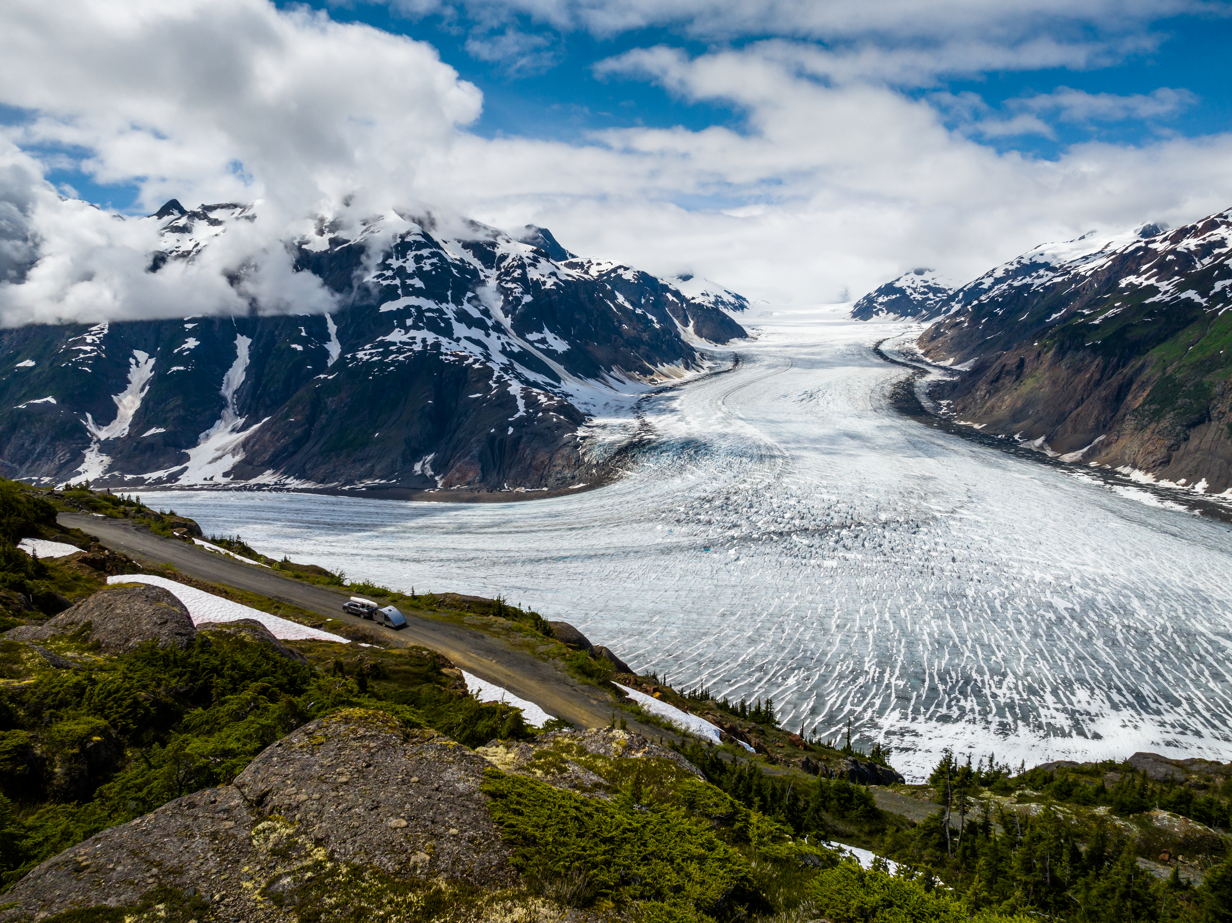 large glacier running through a mountain range near Stewart, British Columbia